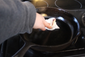 Wipe the pan with a paper towel, or cloth until it is just shiny